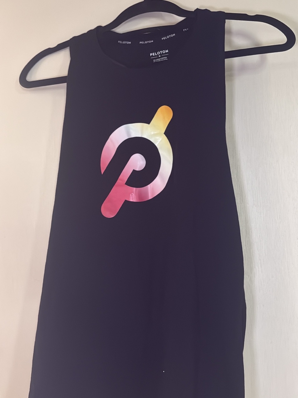 Peloton Black Tank with Pink-Orange-Yellow Gradient Logo